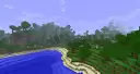 More forest with a sandy beach.