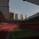 Stadium of FC AVANGARD, with new residential developments towering over the Stalin-era structure.