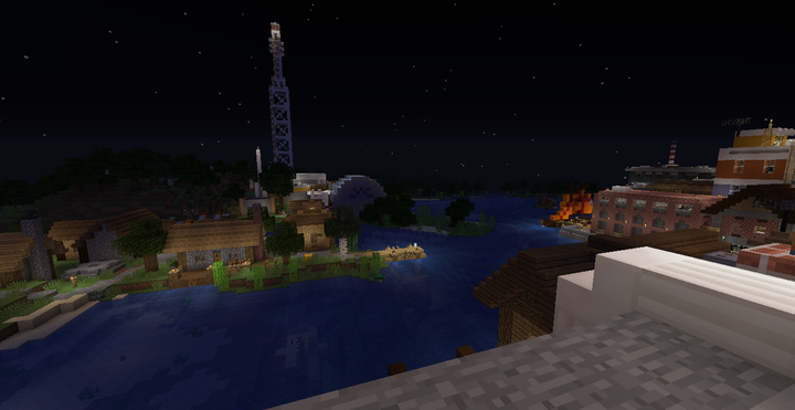 Looking across the Reedy River at night. The GATV studio is seen across the water.