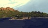 A coastal view of the plains and mountains in the distance